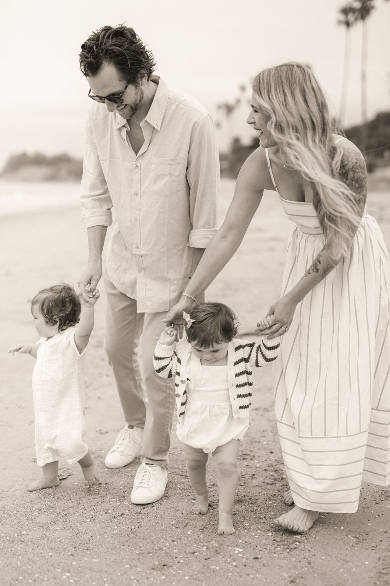 Armon and Linda on the beach with their twins